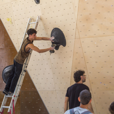 Pierre Broyer route setting for Set'n'Send Boulder Comp on Walltopia natural wood boulder in Sofia, Bulgaria