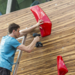 Tsukuru Hori route setting for Set'n'Send Boulder Comp on Walltopia natural wood boulder in Sofia, Bulgaria