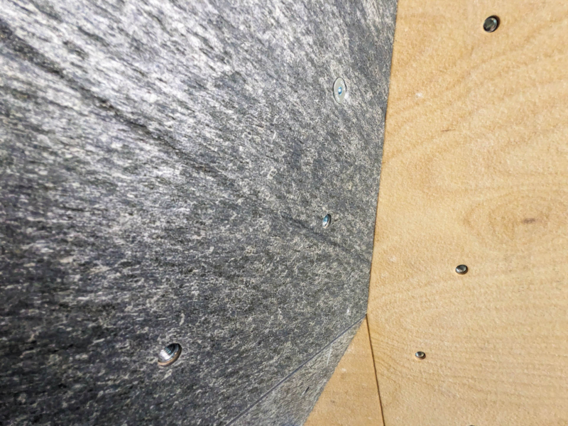 Walltopia boulder climbing walls in Granit Climb, France. Natural wood climbing panels combined with natural stone climbing panels and solid grey panels. Climbmat boulder mats.