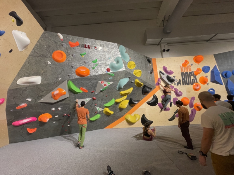 Walltopia boulder climbing walls featuring natural wood and natural stone panels in King Rock climbing gym, Verona, Italy