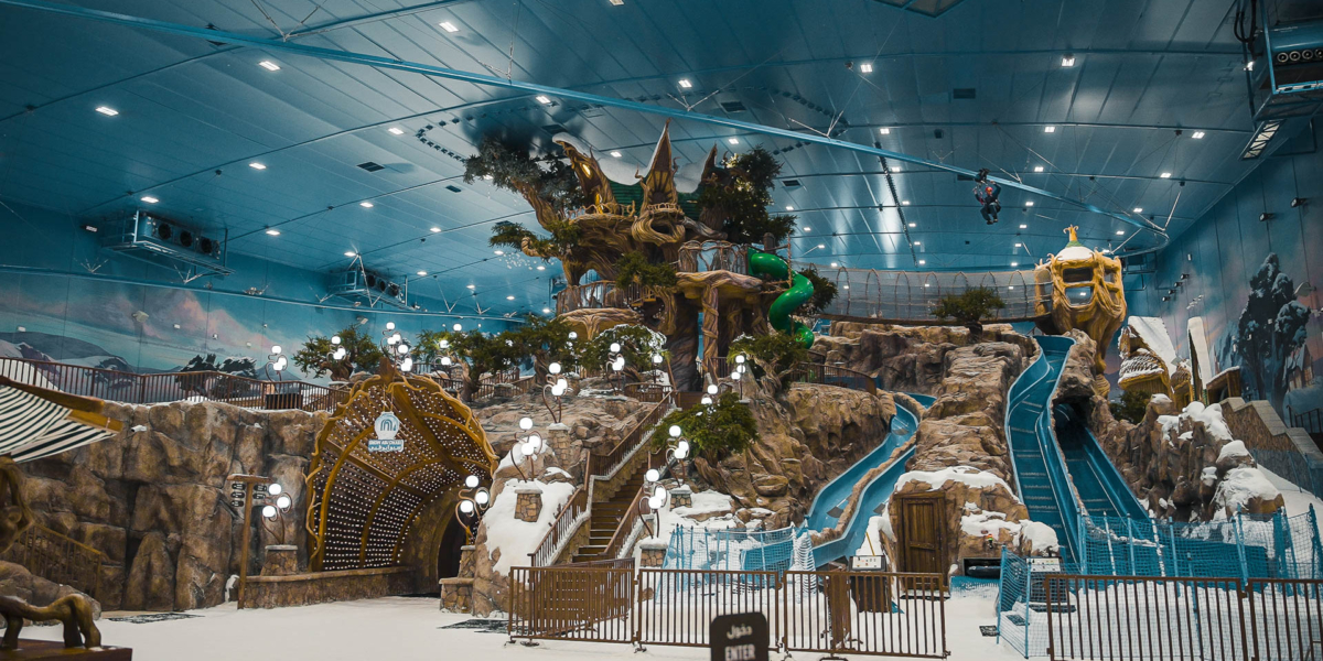 Extreme Rollglider ride over the winder wonderland of the theme park Snow Abu Dhabi - indoor snow park.