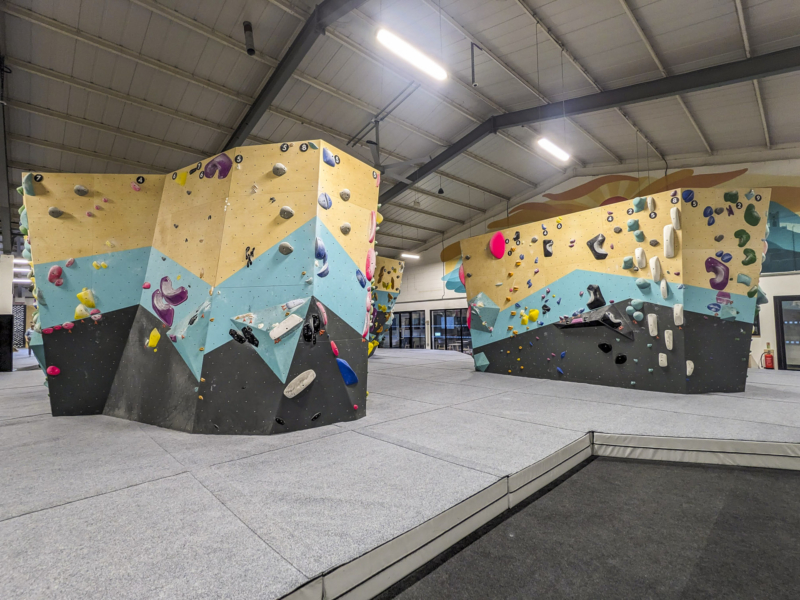 Walltopia bouldering walls with natural wood, lagoon blue and grey in Rainbow Rocket North in Cambridge, UK