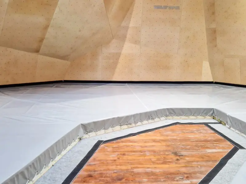 Walltopia bouldering walls in natural wood with unsteppable texture, Climbmat boulder mats with carpet top and special tensioning technique